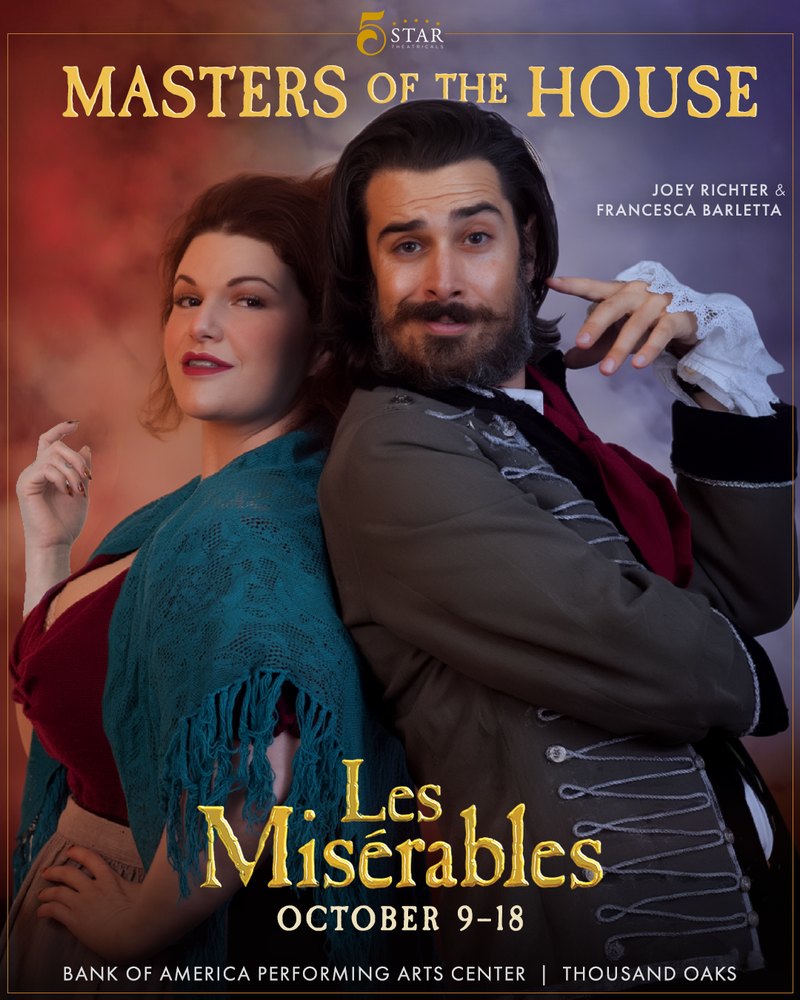Les Misérables ‘Masters of the House’ portrait: Joey Richter and Francesca Barletta as the Thénardiers, back to back and smirking against a red, white and blue smoke backdrop
