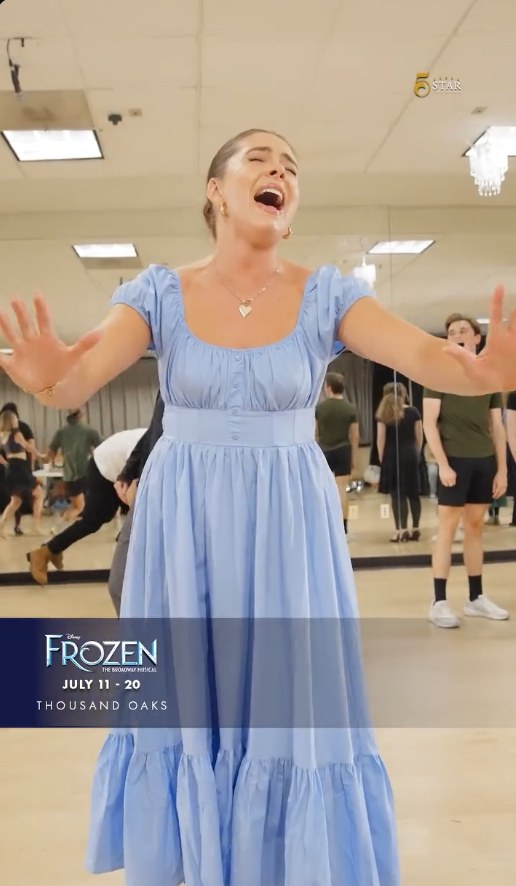 Frozen rehearsal reel: an actor in a blue dress singing full out
